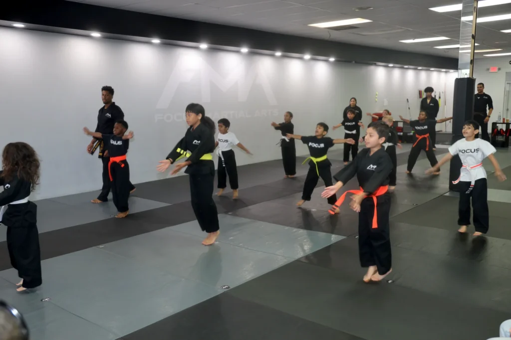 Focus Martial Arts Kids martial arts students in black uniforms and colored