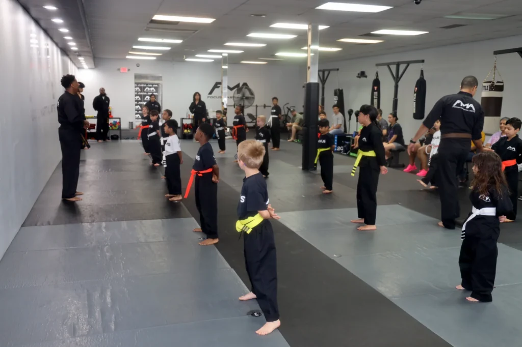 Focus Martial Arts Kids martial arts students standing at attention in rows
